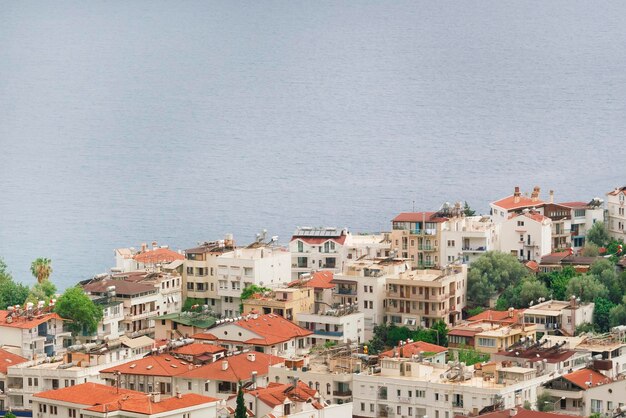 View from above on the red tiled roofs the resort town near the sea