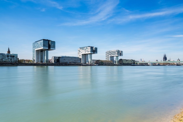 A view from the rhine shore in cologne with Crane Houses and cathedral in germany. Taken outside with a 5D mark III.