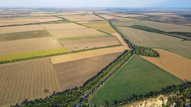 View from above on the road among agricultural fields