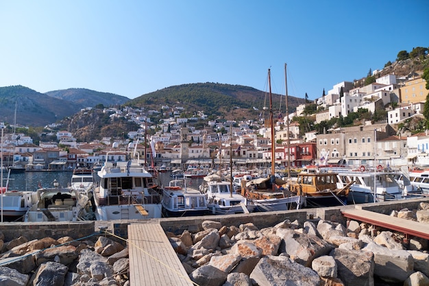 View from the sea to the hydra marina sea port greece