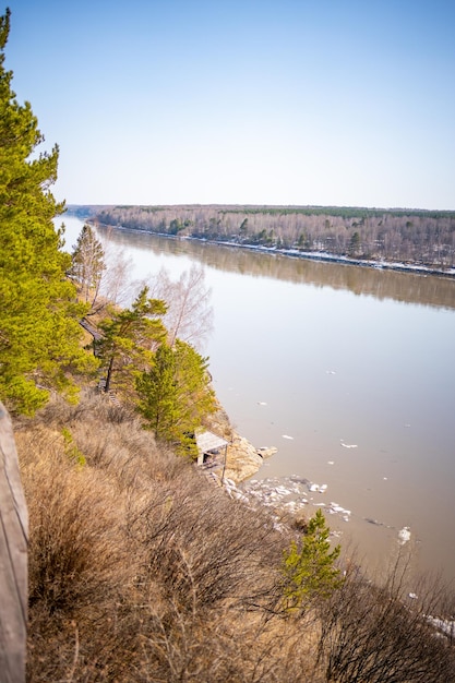 Photo view from the shore of openair museum tomsk pisanitsa located northwest of kemerovo on the right ban