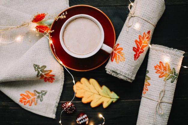 View from above on table with linen kitchen towels and coffee cup Stylish autumn flat lay