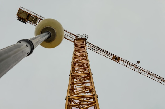 A view from below of a tall tower crane.