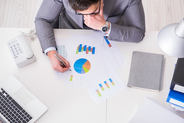 View from top on businessman working on business charts