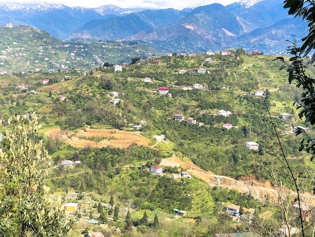 The view from the top from a height of a beautiful tourist city with buildings and houses roofs