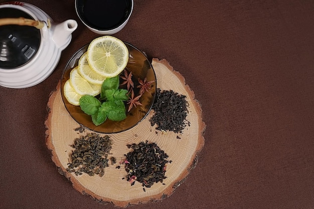 view from the top tea leaves are laid out next to a cup and teapot