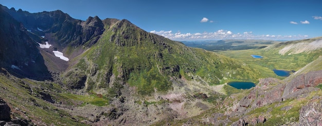 View from the top to the valley with mountain lakes