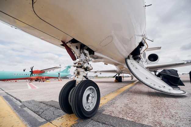 View from below Turboprop aircraft parked on the runway at daytime