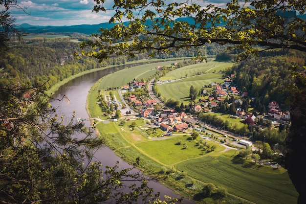 View from viewpoint of Bastei National Park to the town city and the river Elbe. 