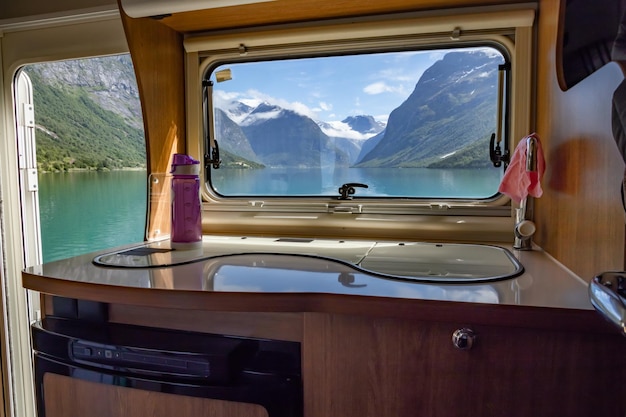 Photo view from the window of the motorhome rv caravan on the beautiful nature of norway. lovatnet lake lodal valley.