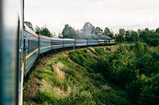 View from the window of wagon of riding train. Vacation concept.