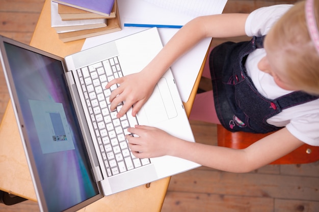 above view of a girl using a notebook
