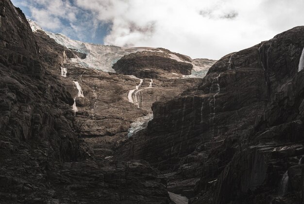 view of a glacier on top of a mountain in Norway