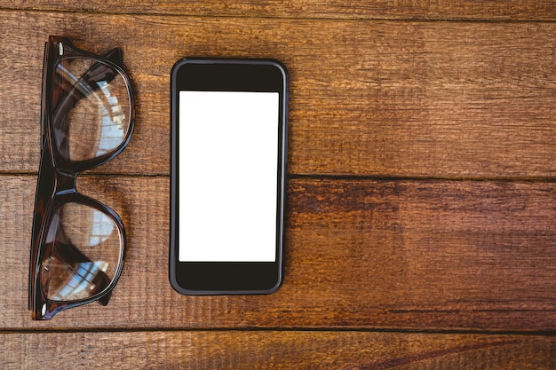 View of glasses and a smartphone