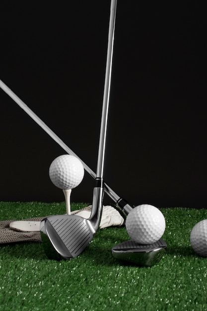 View of golf balls with metallic clubs