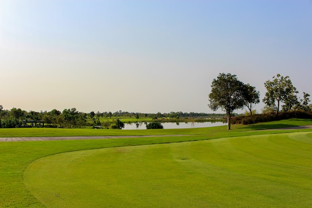 View of Golf course at the sport club with blue sky background.