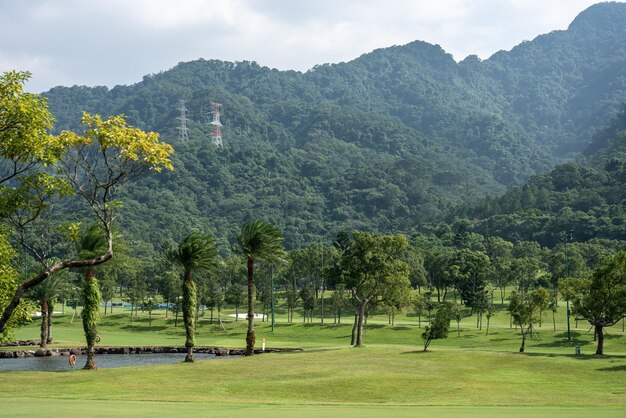 View of golf course with mountain range in the back