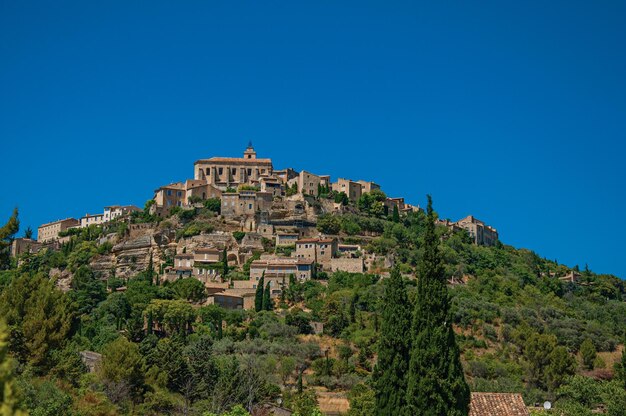 View of gordes village on top of a hill in the french provence