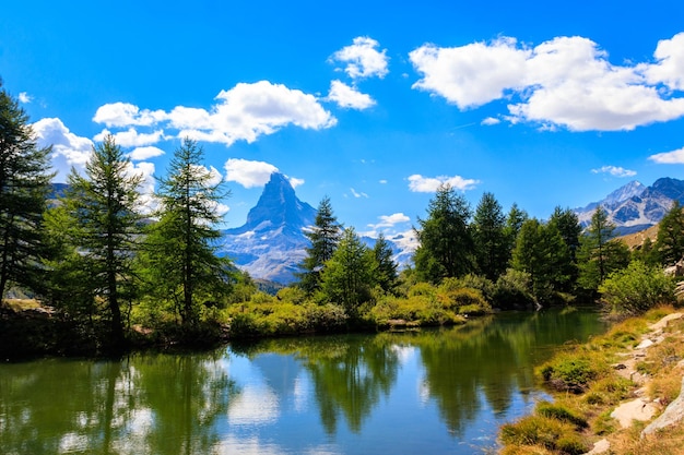 View of Grindji Lake Grindjisee and Matterhorn mountain at summer on Fivelake trail in Zermatt Switzerland