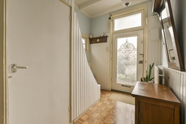 a view of a hallway with a door and stairs