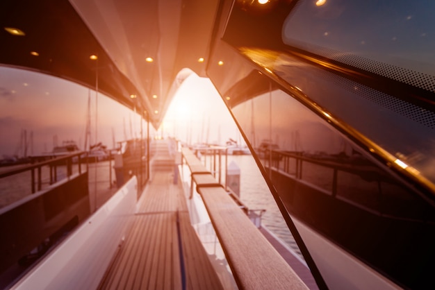 View of harbor with yachts details. Beautiful sunset sky in the marina bay.