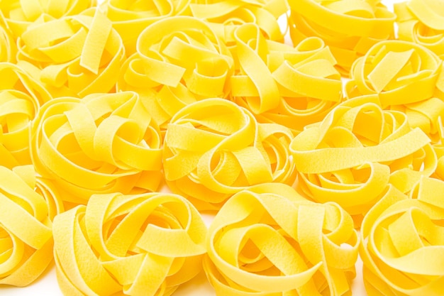 A view of a heap of pasta noodle nests. Taken in studio with a 5D mark III.