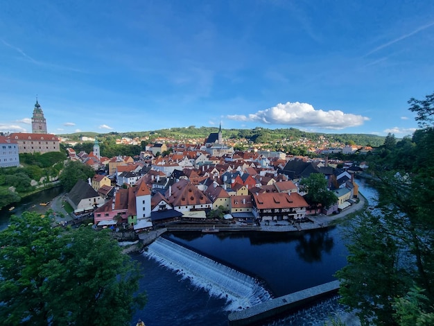 View of historical centre of Cesky Krumlov town on Vltava riverbank on autumn day