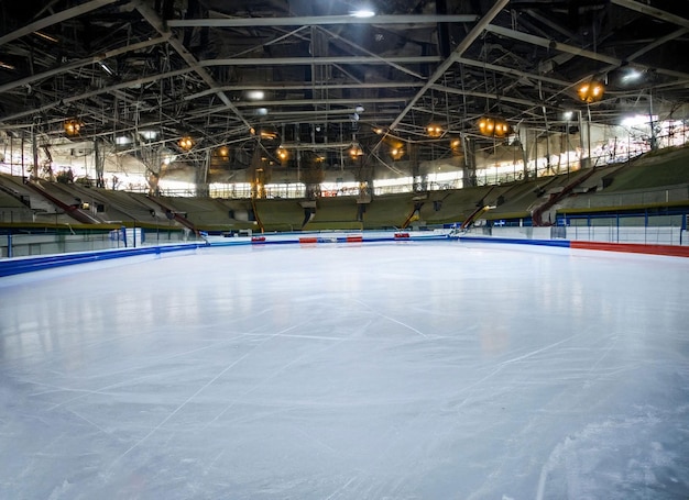 A view of a hockey rink with a blue sign that says " ice ".