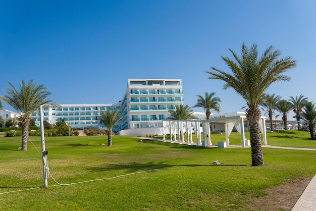 View of the hotel with palm trees and bushes