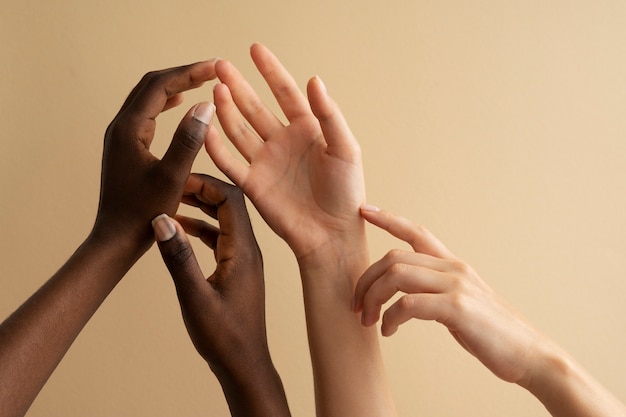 Photo view of human hands against colored background