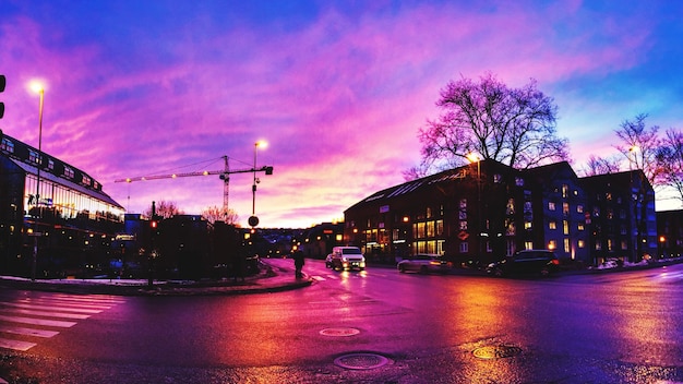 View of illuminated city at sunset