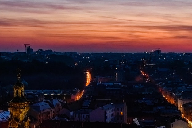 View on illuminated Latin cathedral and historic center of the Lviv at sunset View on Lvov cityscape from the town hall