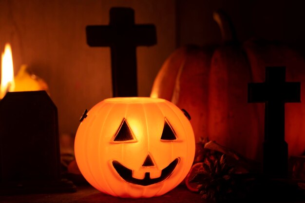 View of illuminated pumpkin against orange wall during halloween