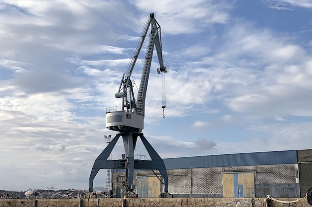 Photo view of industrial harbor cranes in the seaport