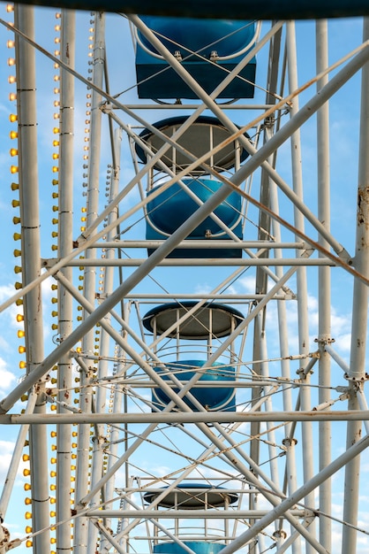 Photo view of inside of ferris wheel view of the structure with cabins