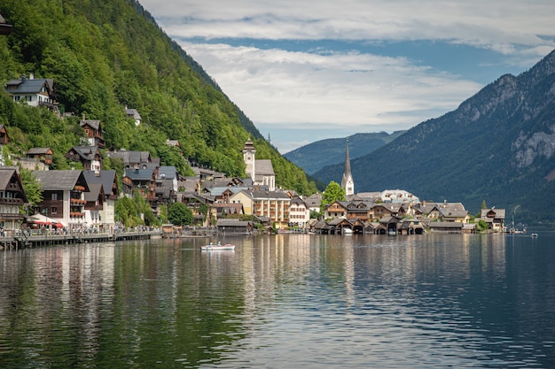 View on lake in austrian town hallstatt during tourist season in summer