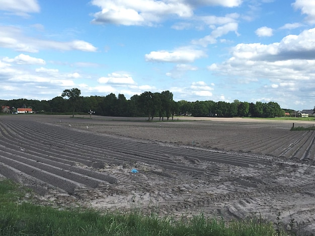 View of land against cloudy sky