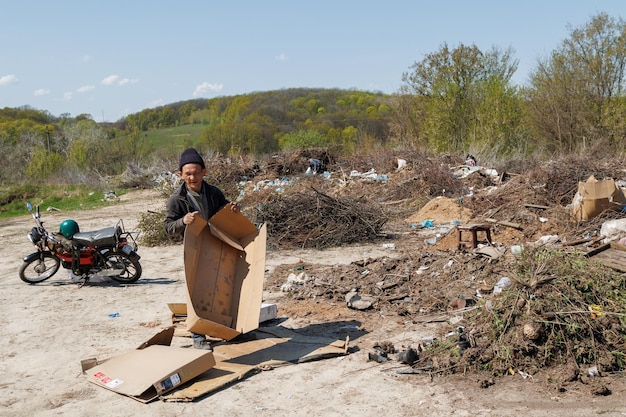 A view of the landfill garbage dump a pile of plastic rubbish
food waste and other rubbish pollution concept a sea of garbage
starts to invade and destroy a beautiful countryside scenery