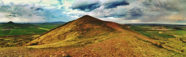 View of landscape against cloudy sky