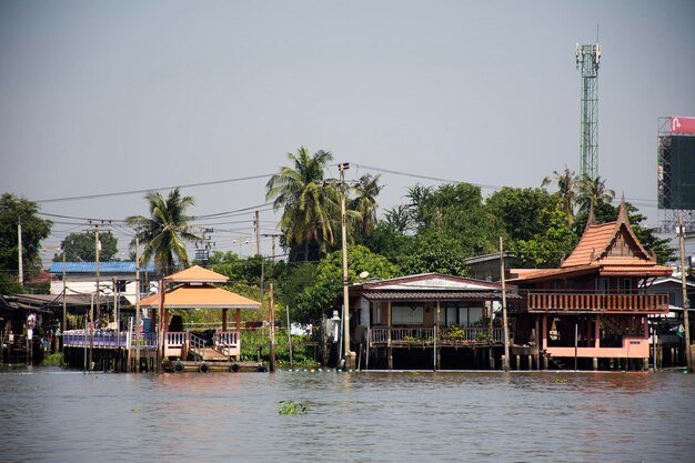 View landscape of chao phraya river with boat ship and cityscape of Pak kret city and life thai people at Ko Kret island in weekday at Nonthaburi Thailand