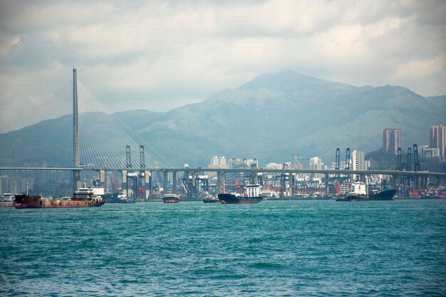 View landscape and cityscape of Hong Kong island with boat and ship in sea of Victoria Harbour at Kennedy Town on September 4 2018 in Hong Kong China