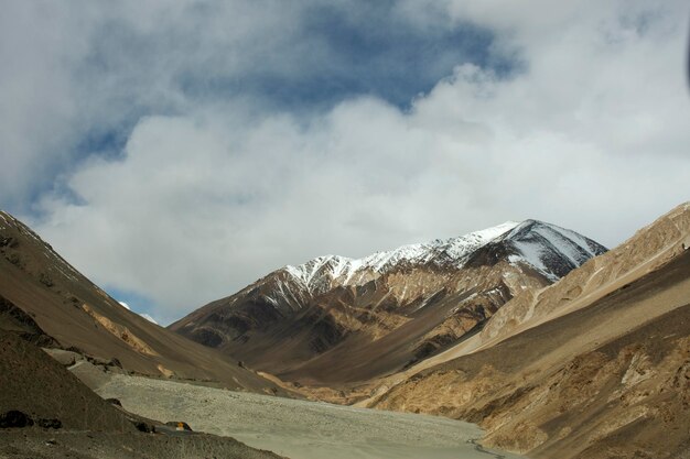 View landscape with Himalayas mountains and between journey Pangong Tso high grassland lake go to Leh Ladakh on Pangong lake road and Khardung La Road while winter season in Jammu and Kashmir India