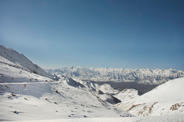 View landscape with Himalayas mountains range between Khardung La road pass go to Nubra Valley in Hunder city while winter season at Leh Ladakh in Jammu and Kashmir India