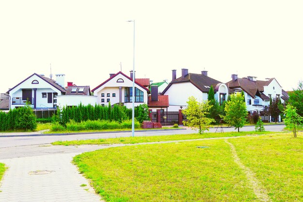 Photo view of lawn with buildings in background