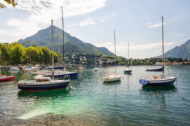 View of Lecco, Italy, with boats at foreground