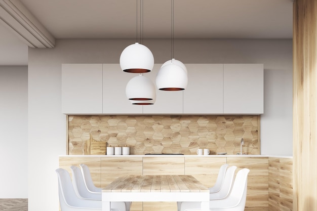 View of a light wooden kitchen interior with white walls and wooden floor. Dining table with white chairs and countertops. 3d rendering mock up