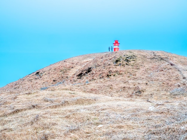 View on lighthouse hill of Stykkisholmur town under twilight evening sky in Iceland