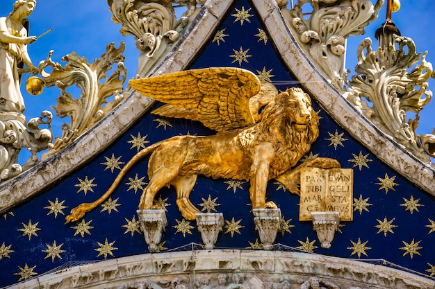 View at Lion of St Mark, symbol of imperial Venice on the Basilica San Marco in Italy