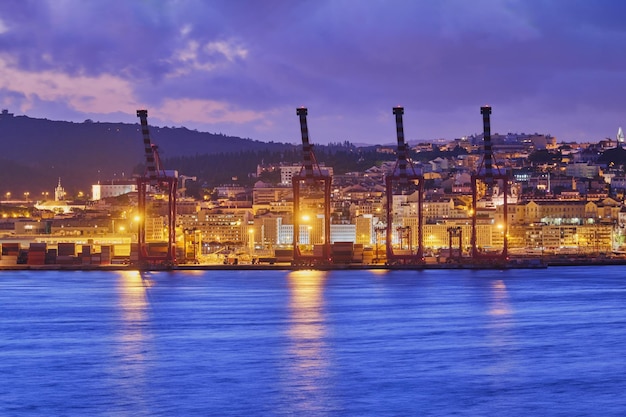 View of Lisbon port with port cranes in the evening