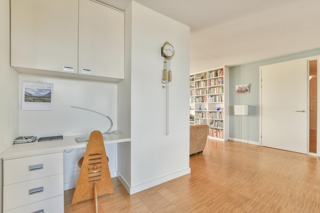 A view of a living room with a desk and